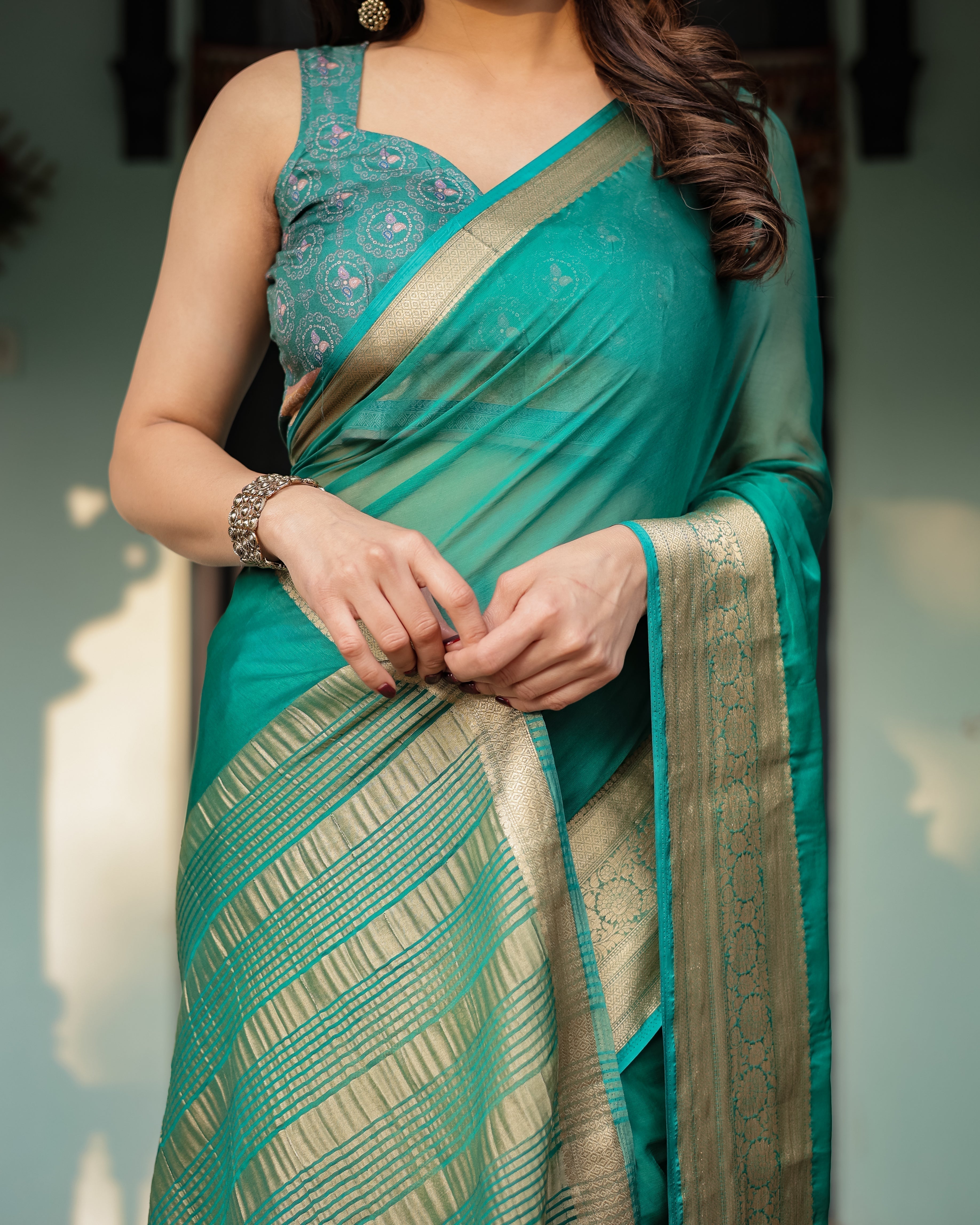 Elegant Sea Green Plain Chiffon Saree with Gold Zari Border, Paisley Printed Blouse & Tassel Detailing CHIFFON