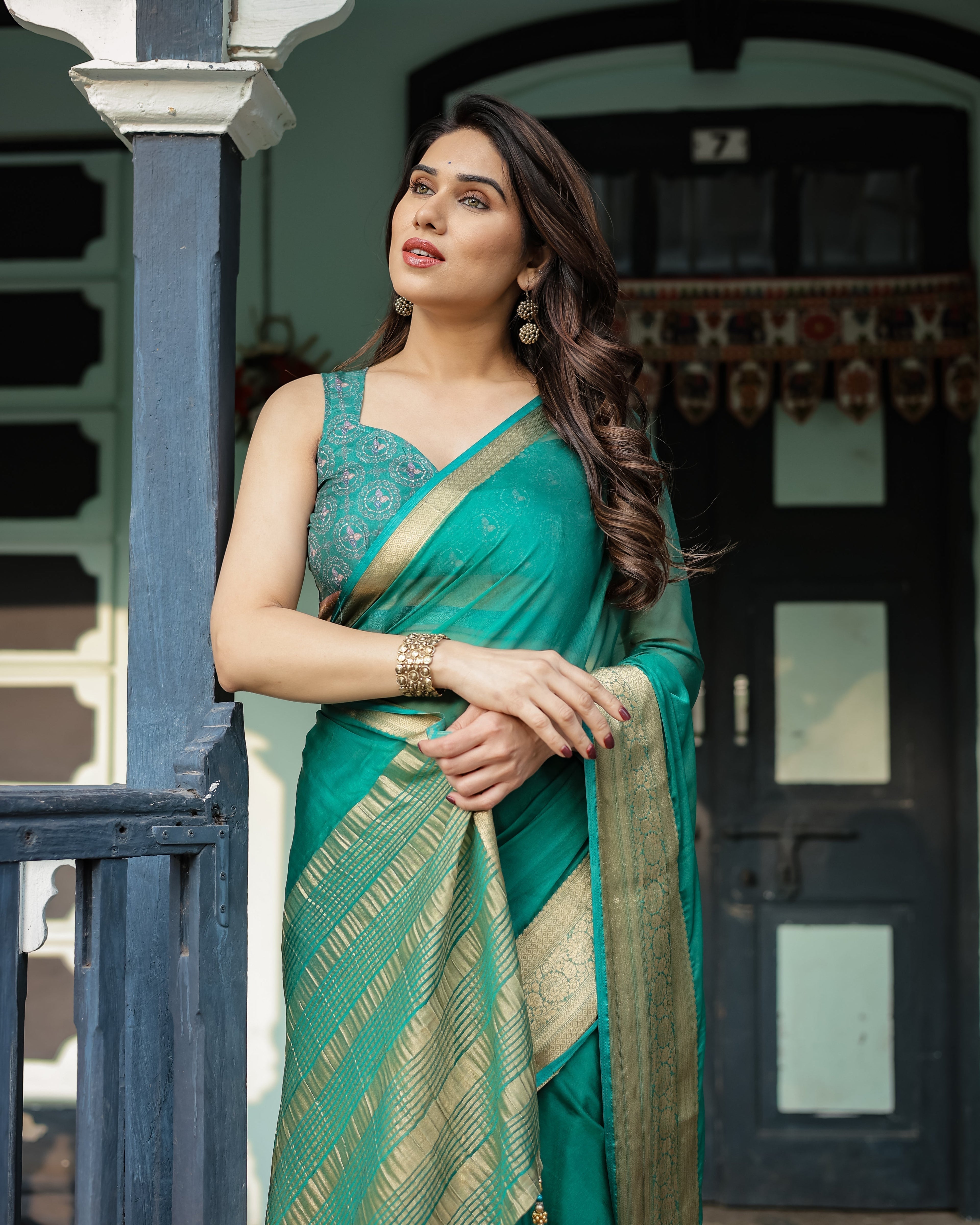 Elegant Sea Green Plain Chiffon Saree with Gold Zari Border, Paisley Printed Blouse & Tassel Detailing CHIFFON