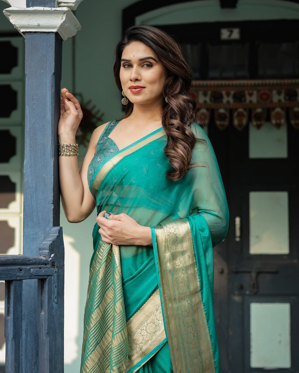 Elegant Sea Green Plain Chiffon Saree with Gold Zari Border, Paisley Printed Blouse & Tassel Detailing CHIFFON