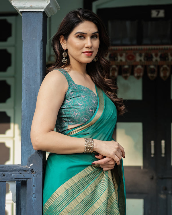 Elegant Sea Green Plain Chiffon Saree with Gold Zari Border, Paisley Printed Blouse & Tassel Detailing CHIFFON
