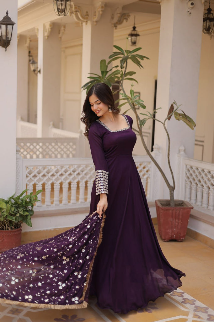 Embrace timeless elegance with our meticulously crafted Vichitra silk Purple gown and dupatta set. ClothsVilla