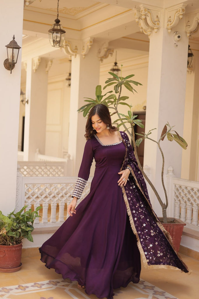 Embrace timeless elegance with our meticulously crafted Vichitra silk Purple gown and dupatta set. ClothsVilla