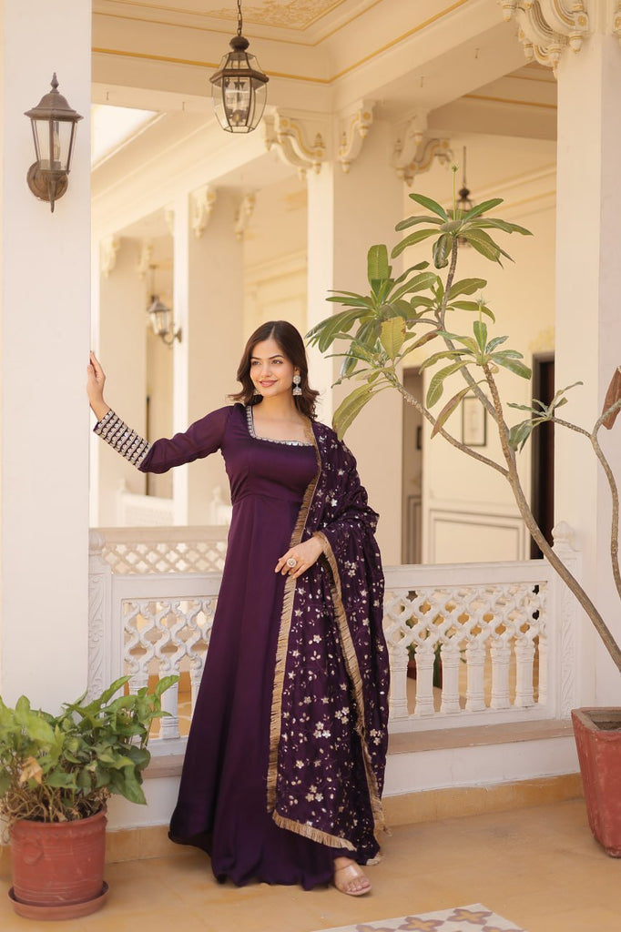 Embrace timeless elegance with our meticulously crafted Vichitra silk Purple gown and dupatta set. ClothsVilla