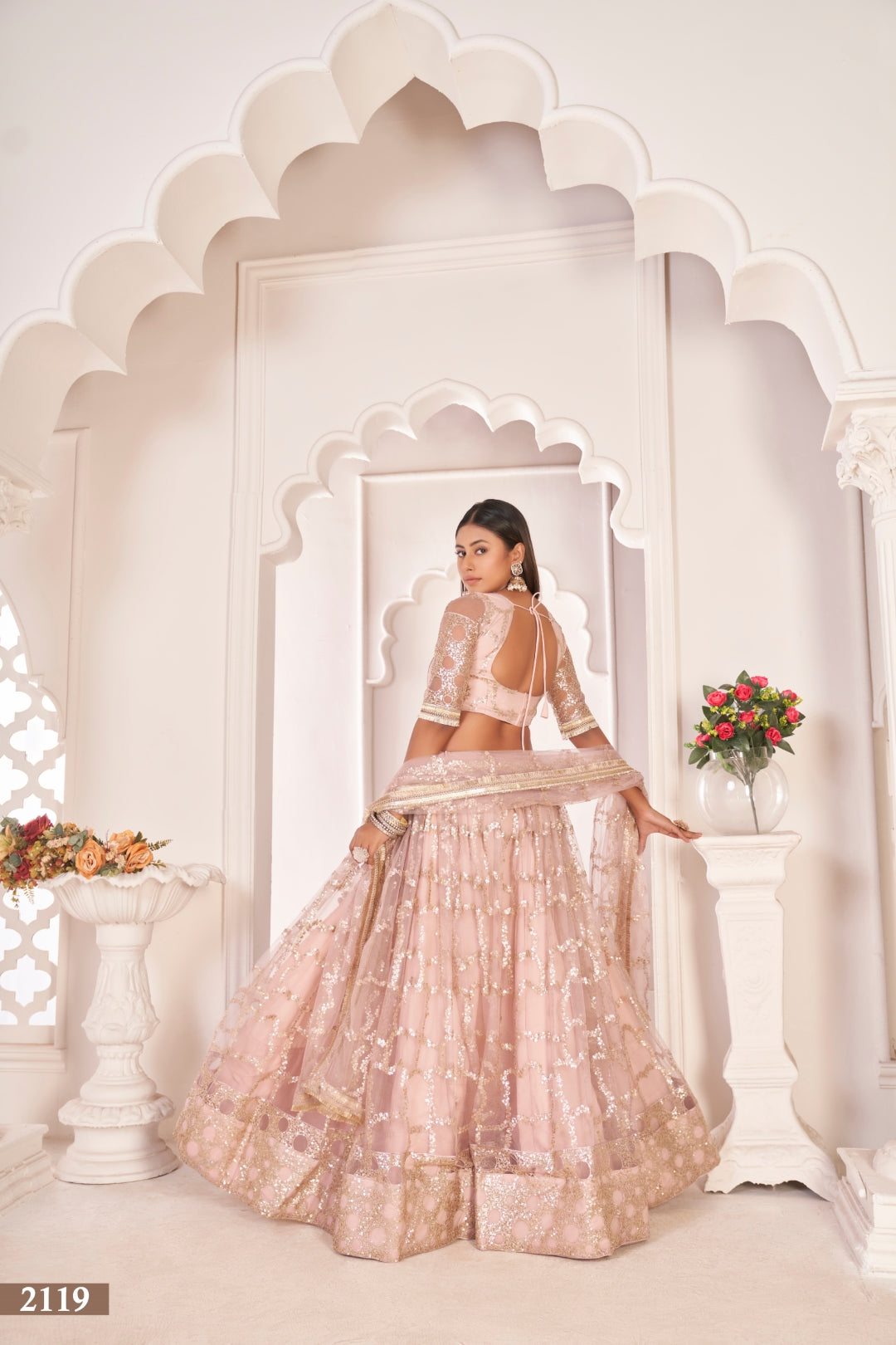 Baby Pink Elegant Butterfly Net Lehenga with Zari & Sequence Embroidery Clothsvilla