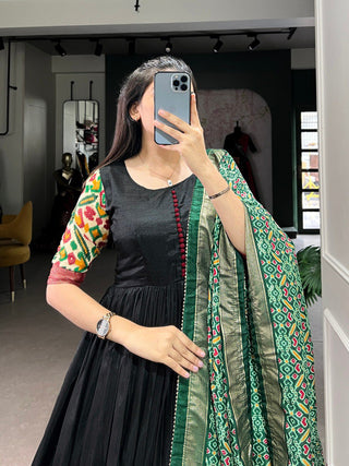 Black Dola Silk Gown with Patola Print Dupatta – Modern Elegance with Foilwork Flair