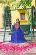 Load image into Gallery viewer, Blue Bandhani Print Faux Georgette Gown with Kutchi Patchwork – Full Sleeves, 9 Meter Flair, Cotton Lining ClothsVilla