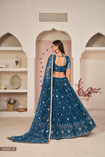 Load image into Gallery viewer, Blue Luxurious Butterfly Net Lehenga with All-Over Embroidery Clothsvilla