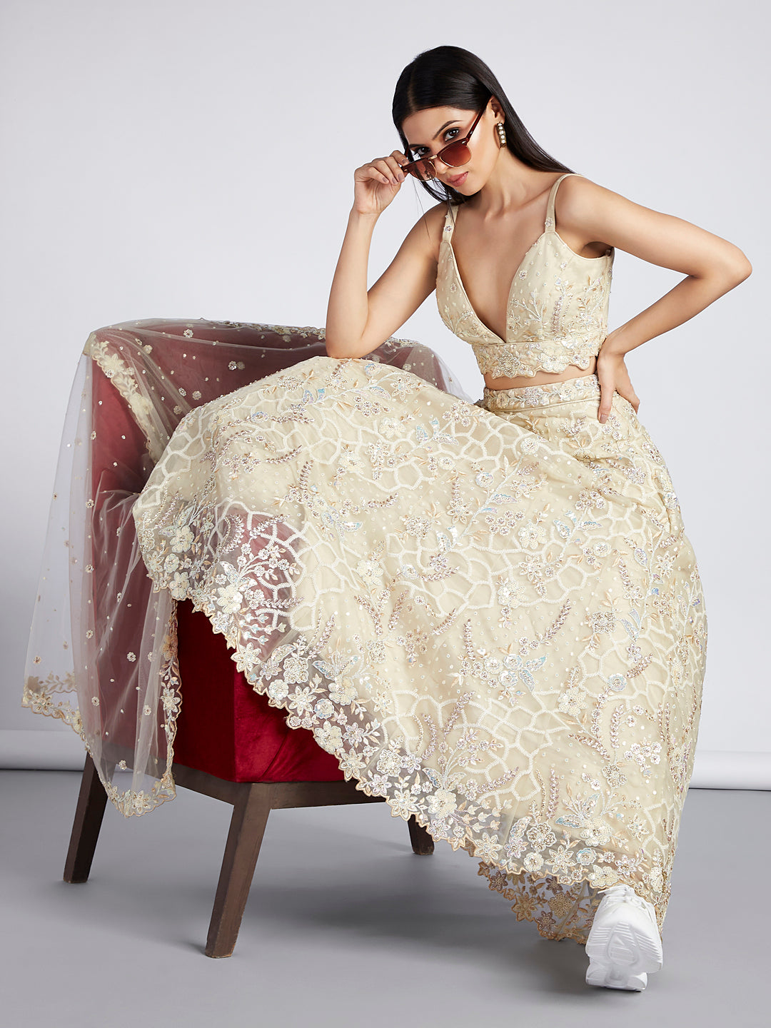 Captivating Cream Net Lehenga with Sequin & Zari Embellishments ClothsVilla