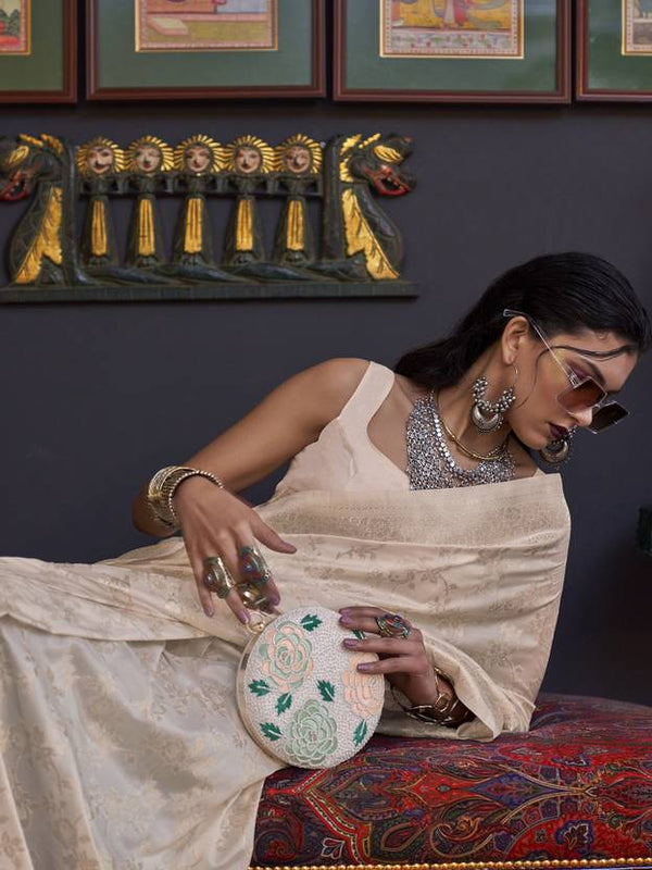 Cream Banarasi Silk Blend Saree with Bidri Work & Zari Buta – Gold Accents & Tassel Detailing ClothsVilla