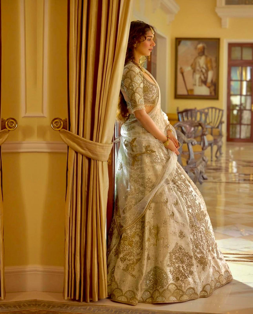 Cream Heavy Slub Silk Lehenga with Sequins, Dori & Zari Work, Matching Blouse & Net Dupatta ClothsVilla