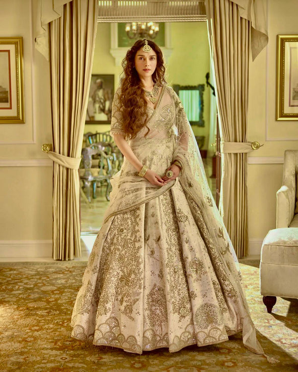 Cream Heavy Slub Silk Lehenga with Sequins, Dori & Zari Work, Matching Blouse & Net Dupatta ClothsVilla