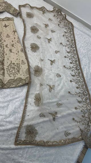 Cream Heavy Slub Silk Lehenga with Sequins, Dori & Zari Work, Matching Blouse & Net Dupatta ClothsVilla