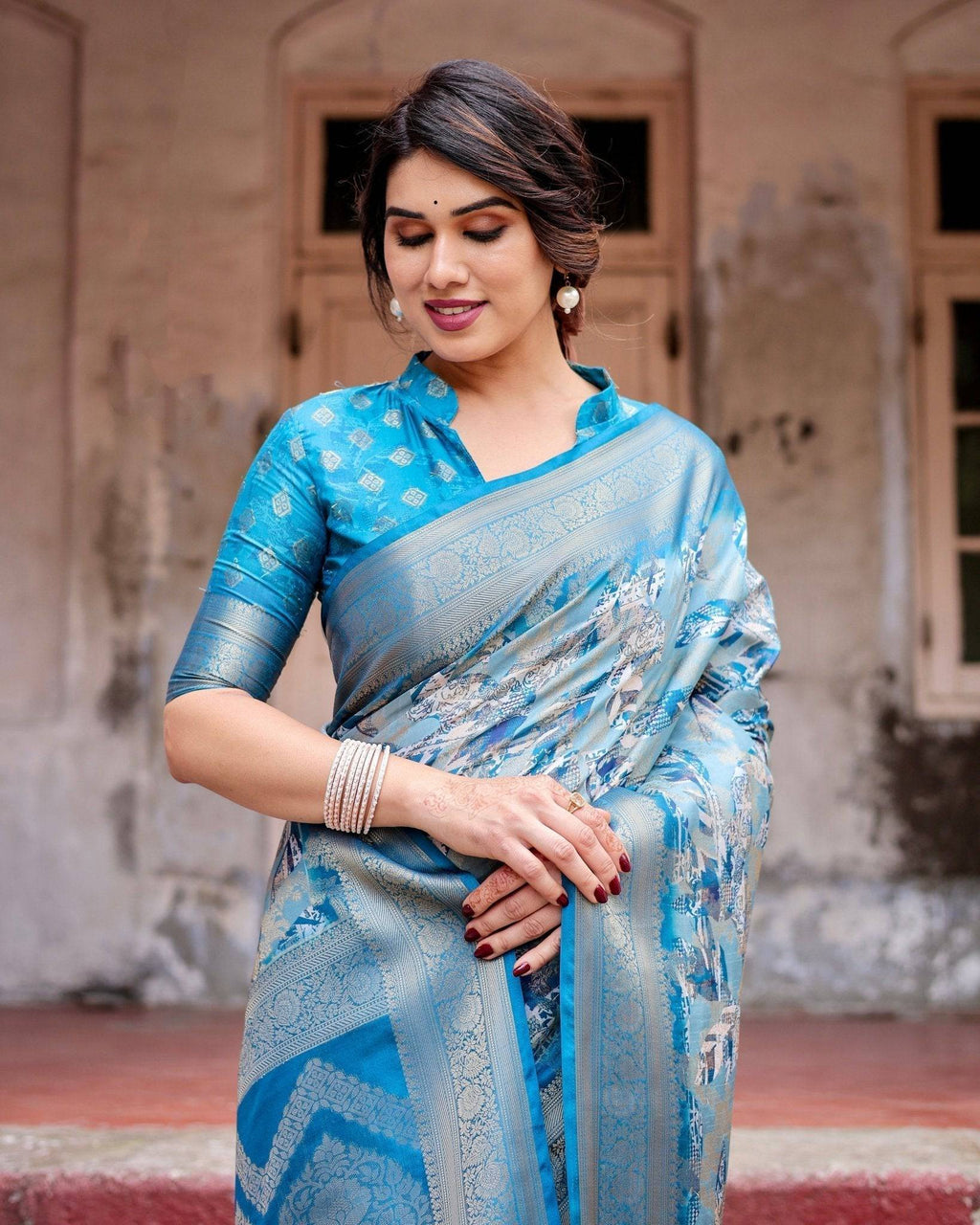 Aqua Blue Banarasi Silk Saree with Zari Border, Floral Motifs, and Tassels BANARASI PRINTED