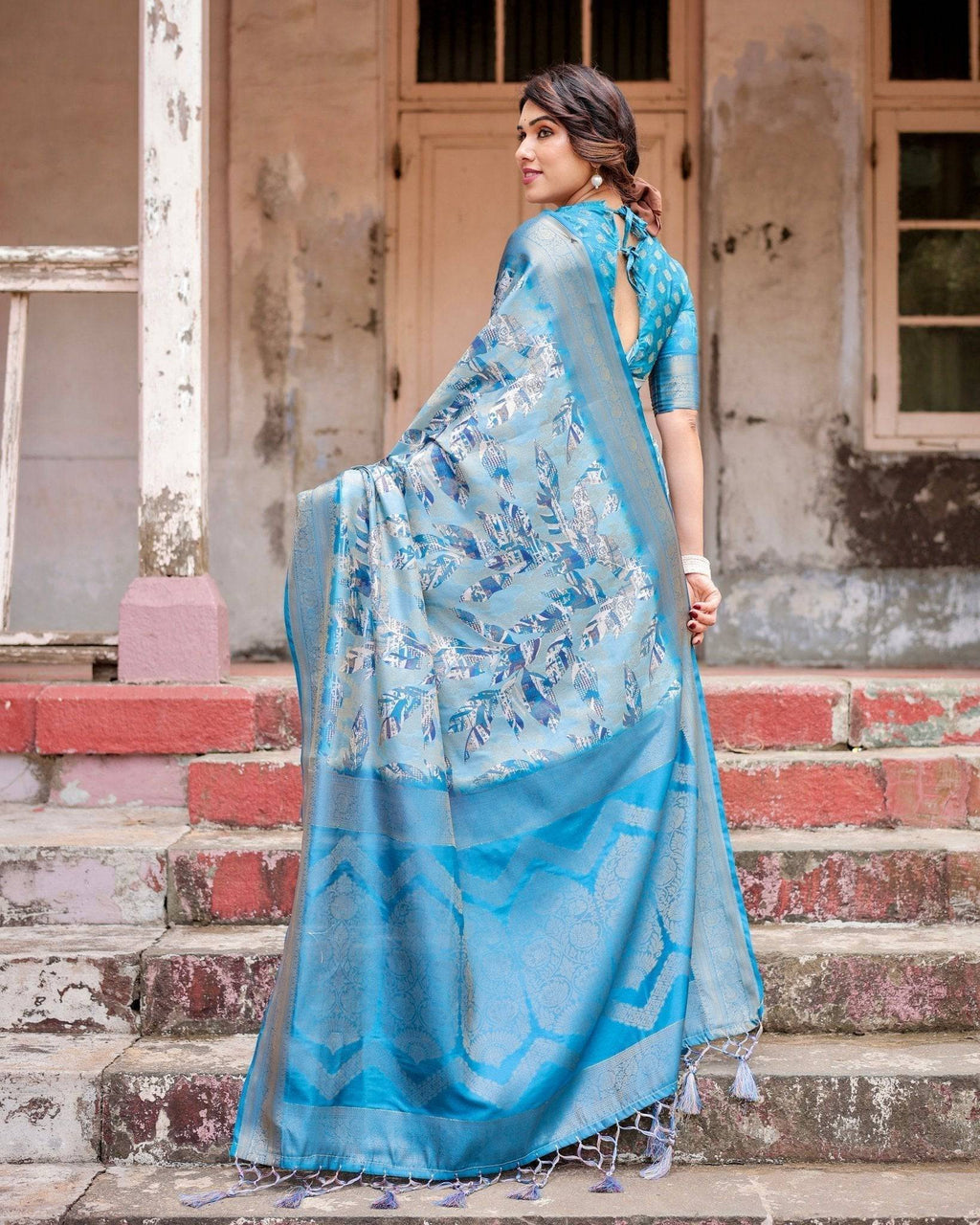 Aqua Blue Banarasi Silk Saree with Zari Border, Floral Motifs, and Tassels BANARASI PRINTED