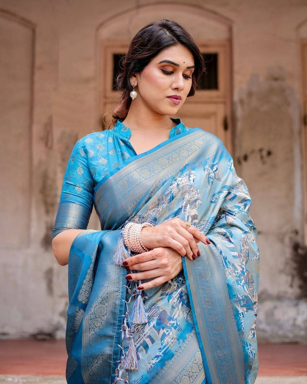Aqua Blue Banarasi Silk Saree with Zari Border, Floral Motifs, and Tassels BANARASI PRINTED