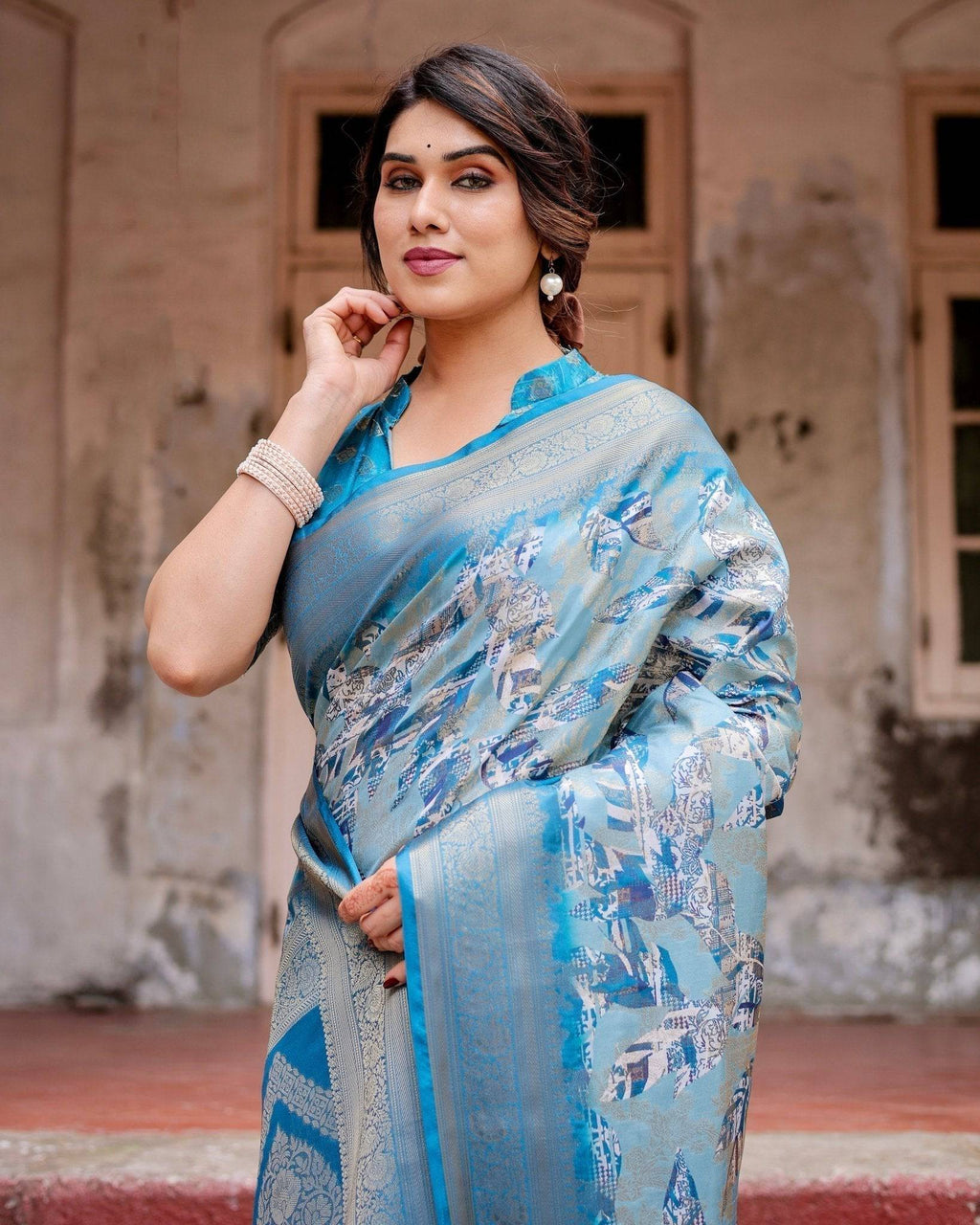 Aqua Blue Banarasi Silk Saree with Zari Border, Floral Motifs, and Tassels BANARASI PRINTED