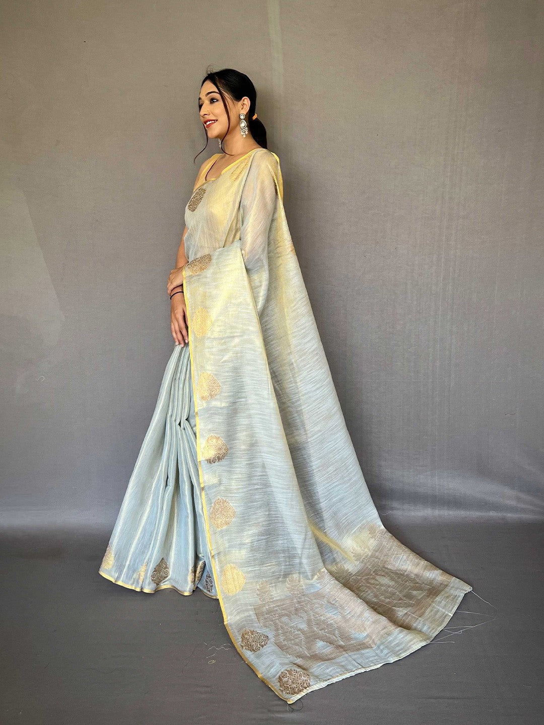 Dusty Blue Elegant Woven Tissue Silk Saree with Gold Accents Party & Festive Wear ClothsVilla