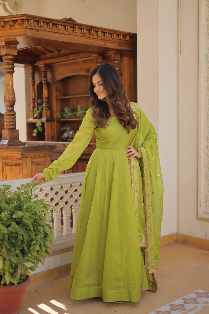 Enchanting Parrot Green Russian Silk Gown-Dupatta Set with Exquisite Sequined Embroidery and Lace Border ClothsVilla