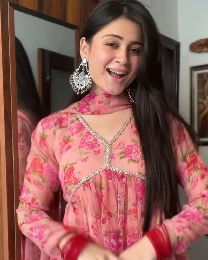 Exquisite Peach Floral Nayra Cut Kurti with Fancy Puff Sleeves & Flared Silhouette ClothsVilla