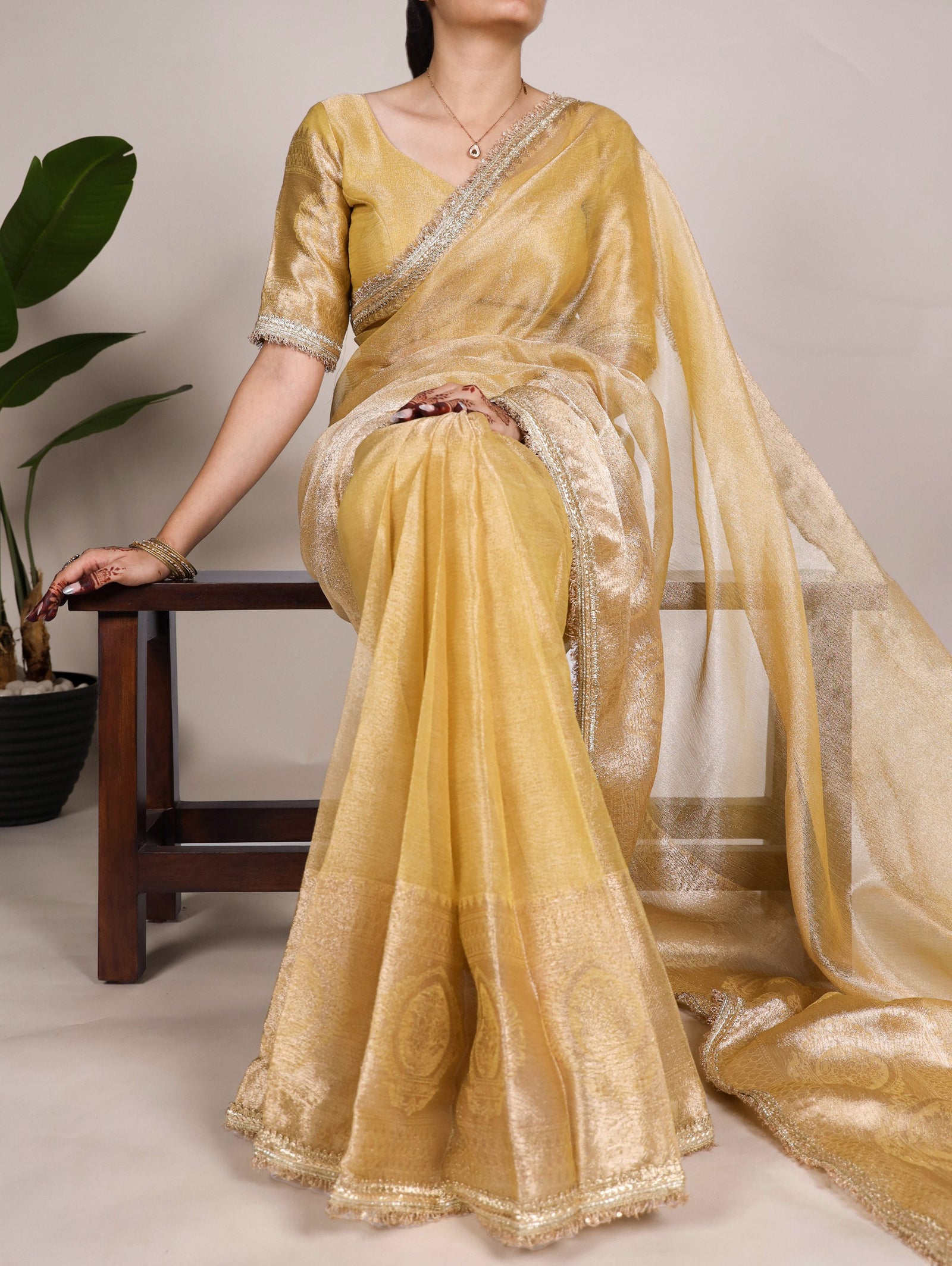 Gold Elegant Tissue Shimmer Saree with Zari Weaving and Sequins Lace Border
