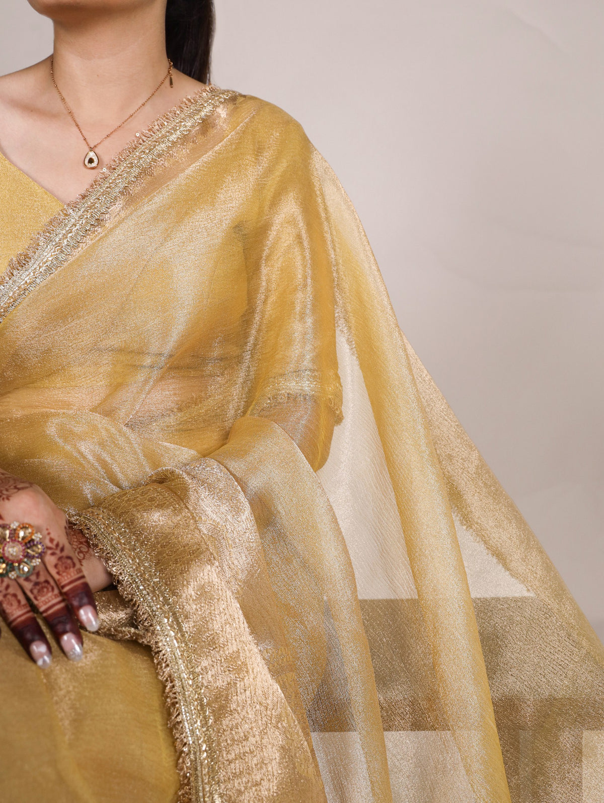 Gold Elegant Tissue Shimmer Saree with Zari Weaving and Sequins Lace Border