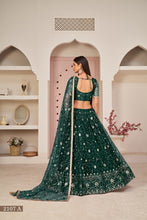 Load image into Gallery viewer, Green Luxurious Butterfly Net Lehenga with All-Over Embroidery Clothsvilla