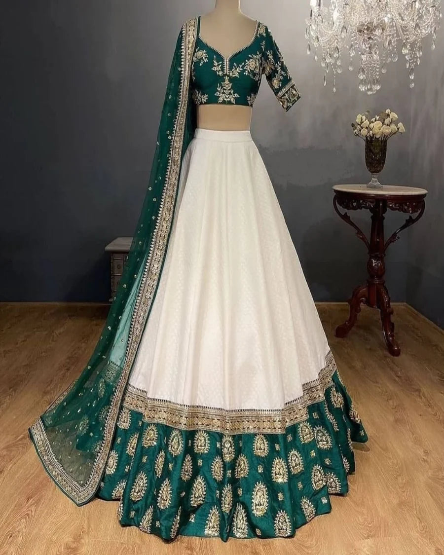 White Elegant Tapeta Silk Lehenga with Pearl & Embroidery Work ClothsVilla Main image