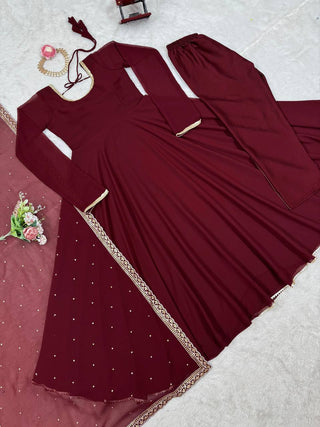 Maroon Glamorous Faux Georgette Gown with Sequined Lace Border & Dupatta ClothsVilla
