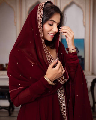 Maroon Glamorous Faux Georgette Gown with Sequined Lace Border & Dupatta ClothsVilla