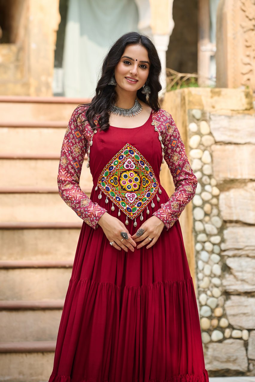 Maroon Navratri Special Gown with Kutchi Gamthi Embroidery – 3 Layer Frill & 12 Meter Flair ClothsVilla