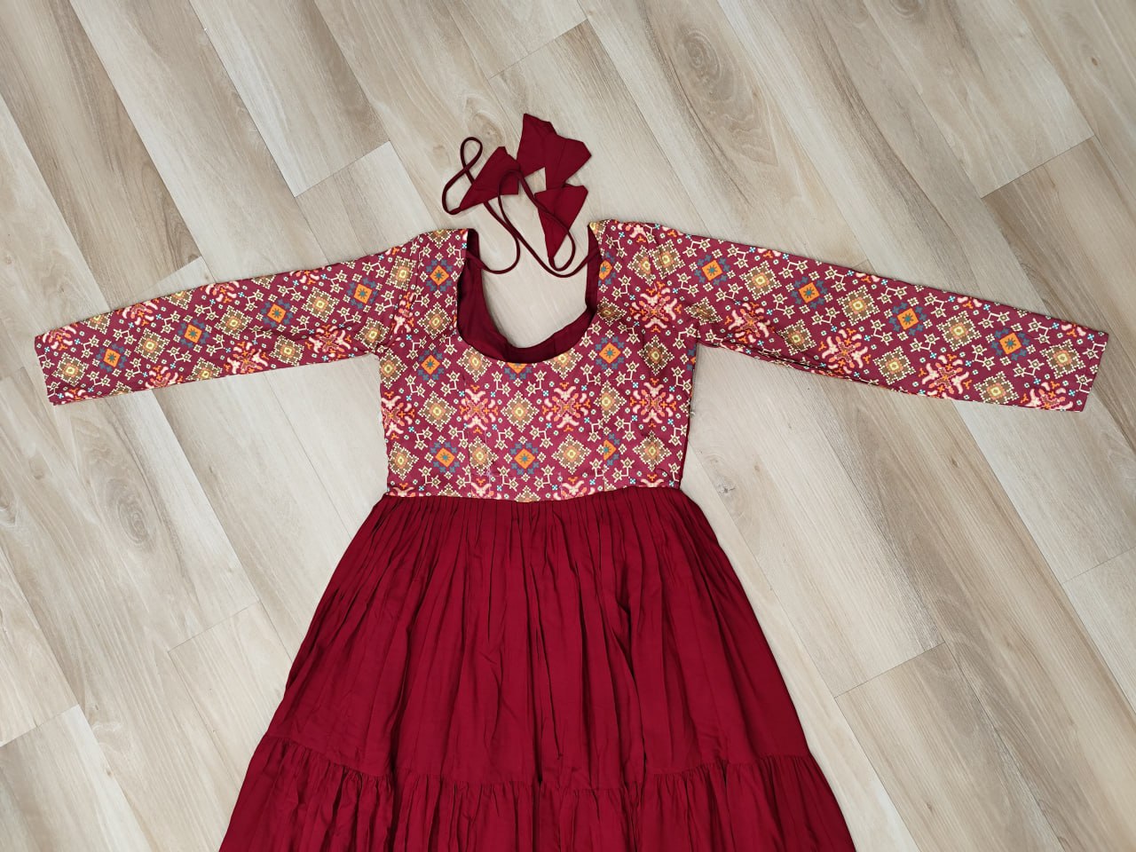 Maroon Navratri Special Gown with Kutchi Gamthi Embroidery – 3 Layer Frill & 12 Meter Flair ClothsVilla