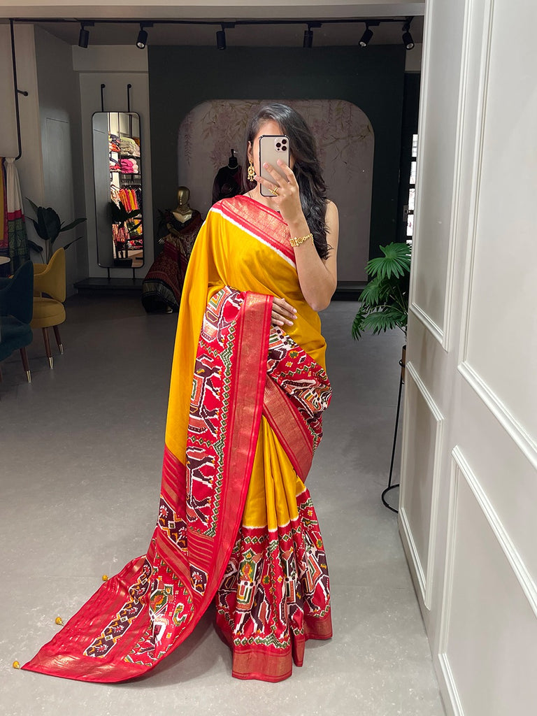 Mustard Color Dola Silk Patola Saree with Shimmering Foil Work ClothsVilla