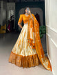 Load image into Gallery viewer, Mustard Elegant Dola Silk Shibori Print Lehenga Set with Zari Weaving Border