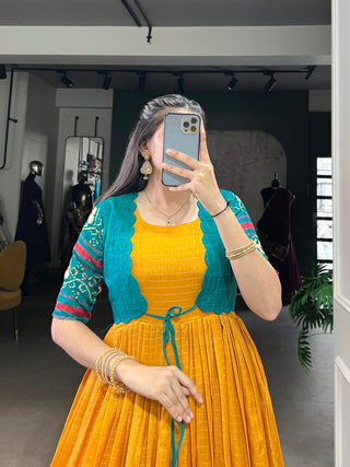Mustard Patola Print Tasar Chex Gown with Matching Koti – Stitched Ethnic Wear Set with Weaving Border & Micro Cotton Lining ClothsVilla