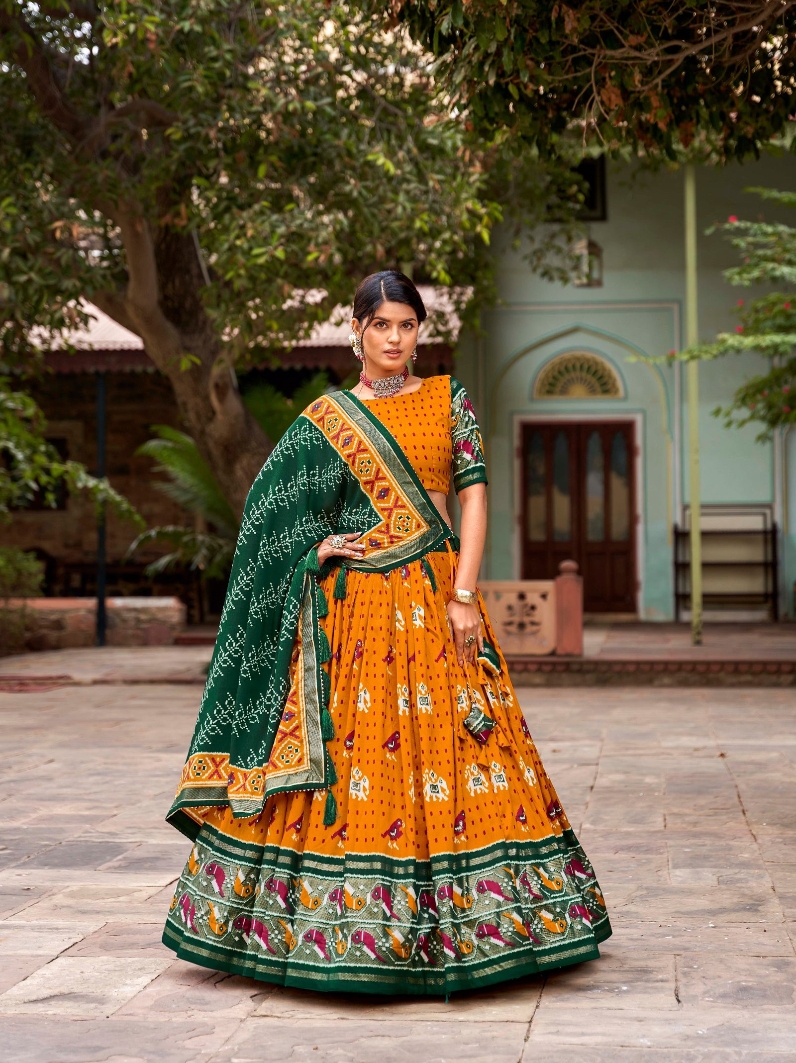 Mustard Tussar Silk Lehenga Choli with Enchanting Ikat Patola Print and Foil Work ClothsVilla