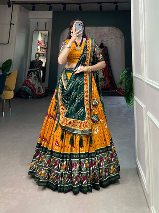 Mustard Tussar Silk Lehenga Choli with Enchanting Ikat Patola Print and Foil Work ClothsVilla