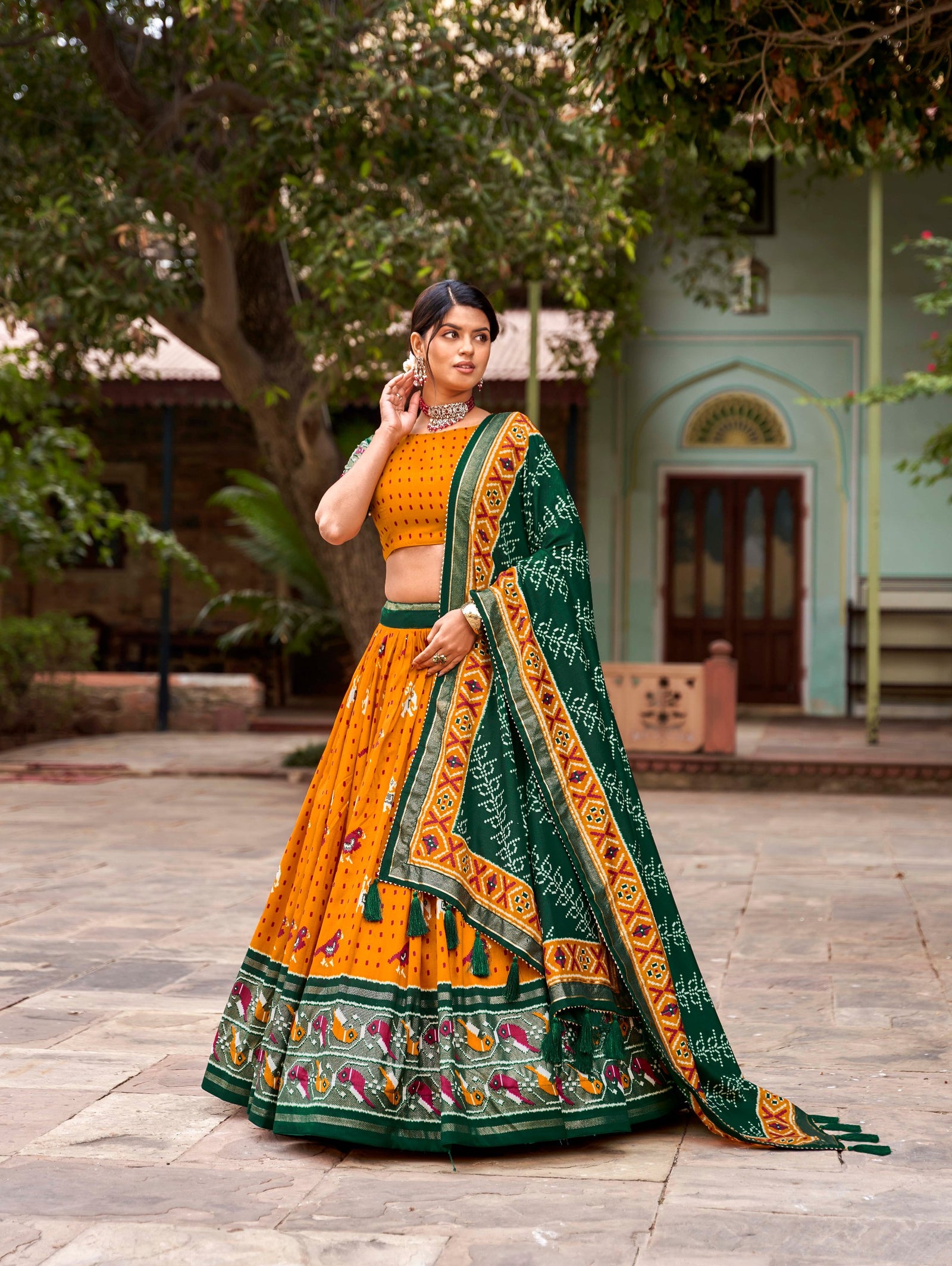 Mustard Tussar Silk Lehenga Choli with Enchanting Ikat Patola Print and Foil Work ClothsVilla