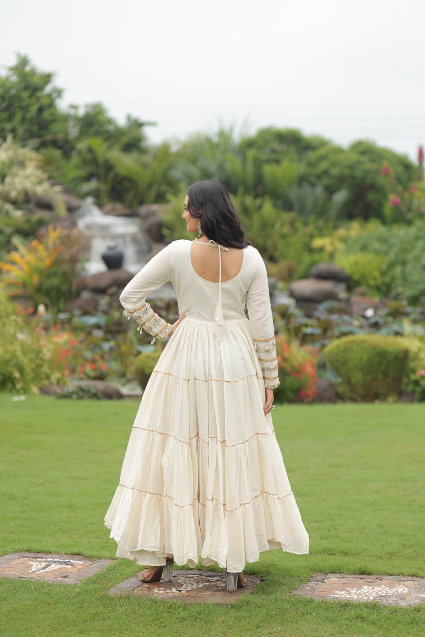 Off-White Navaratri Special Kora Cotton Embroidered Gown with Gota Patti Work & 12 Meter Flair ClothsVilla
