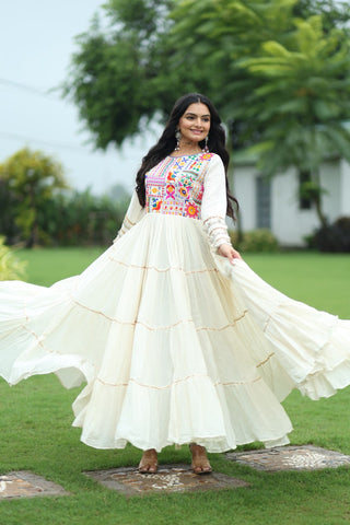Off-White Navaratri Special Kora Cotton Embroidered Gown with Gota Patti Work & 12 Meter Flair ClothsVilla