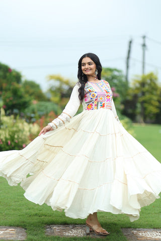 Off-White Navaratri Special Kora Cotton Embroidered Gown with Gota Patti Work & 12 Meter Flair ClothsVilla