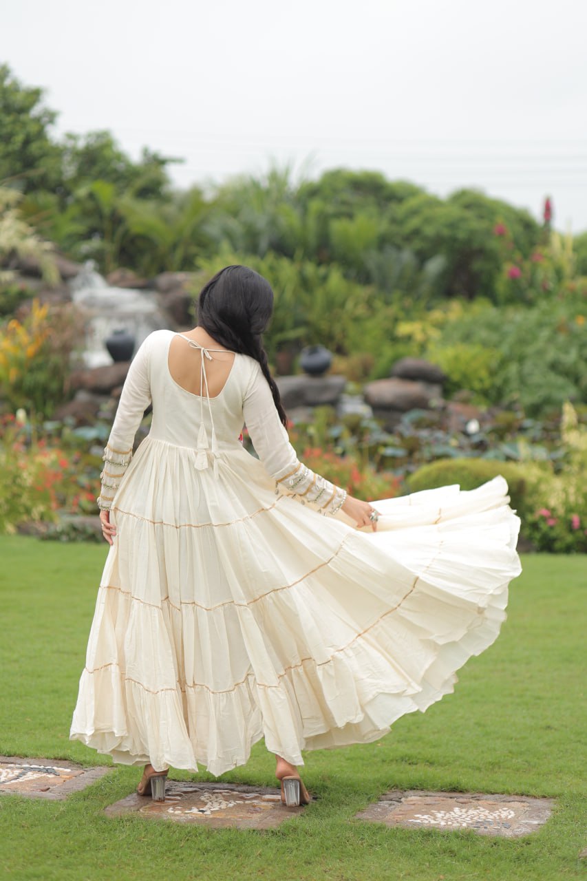 Off-White Navaratri Special Kora Cotton Embroidered Gown with Gota Patti Work & 12 Meter Flair ClothsVilla
