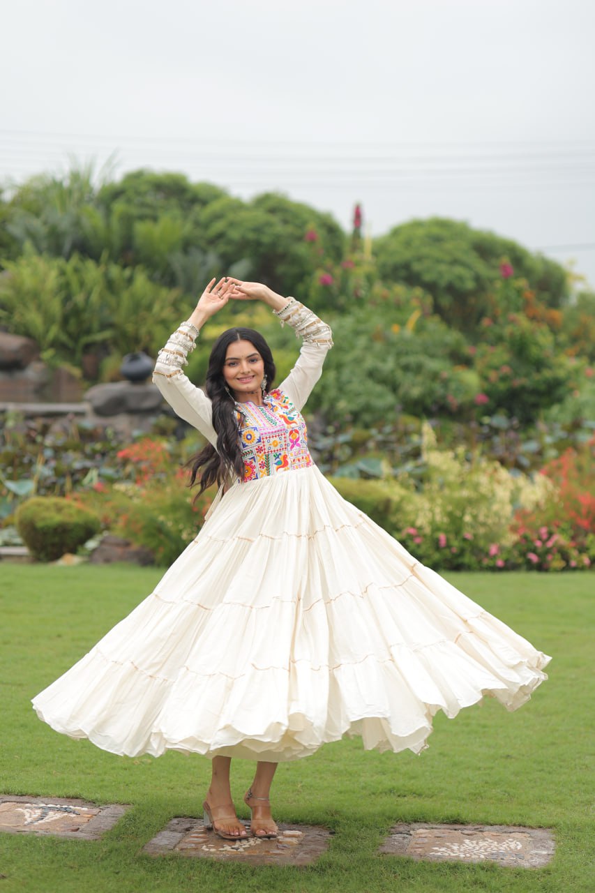 Off-White Navaratri Special Kora Cotton Embroidered Gown with Gota Patti Work & 12 Meter Flair ClothsVilla