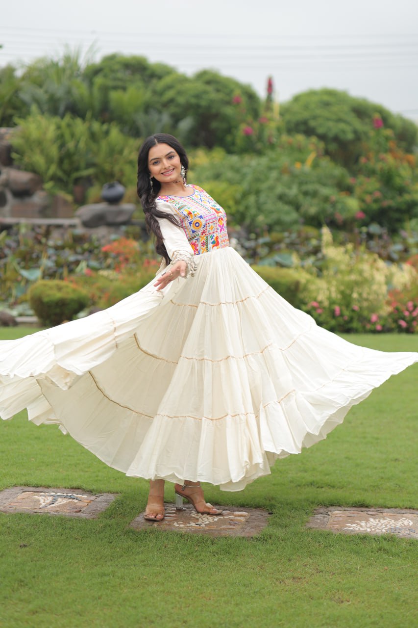 Off-White Navaratri Special Kora Cotton Embroidered Gown with Gota Patti Work & 12 Meter Flair ClothsVilla