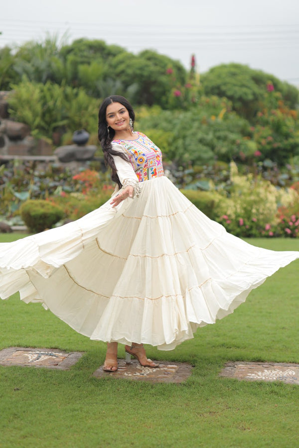 Off-White Navaratri Special Kora Cotton Embroidered Gown with Gota Patti Work & 12 Meter Flair ClothsVilla
