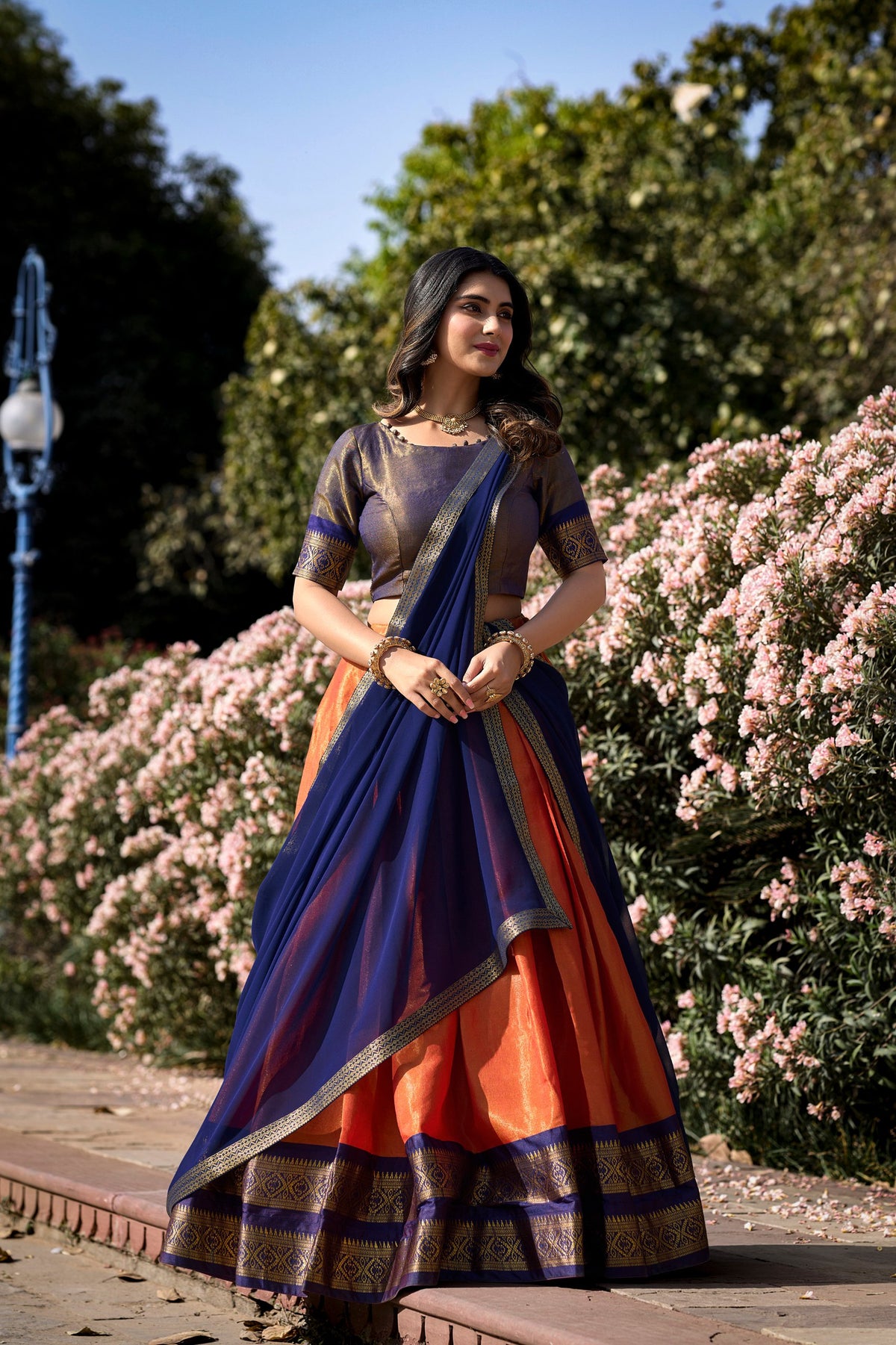 Orange Breathtaking South-Indian Kanchipuram Silk Lehenga Choli Set with Zari Weaving ClothsVilla Main image