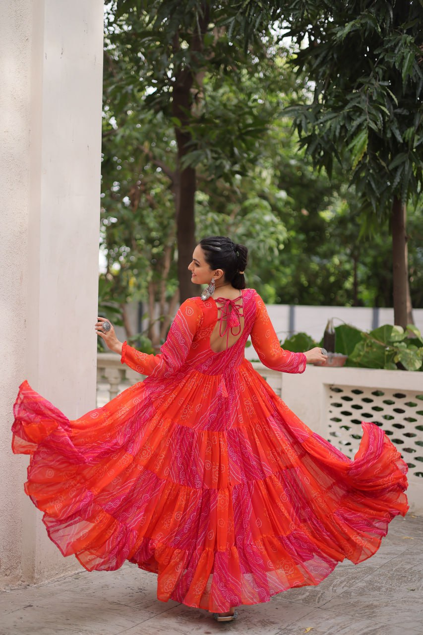 Orange Navratri Special Laheriya & Bandhej Printed Faux Georgette Gown with Kutchi Patchwork ClothsVilla
