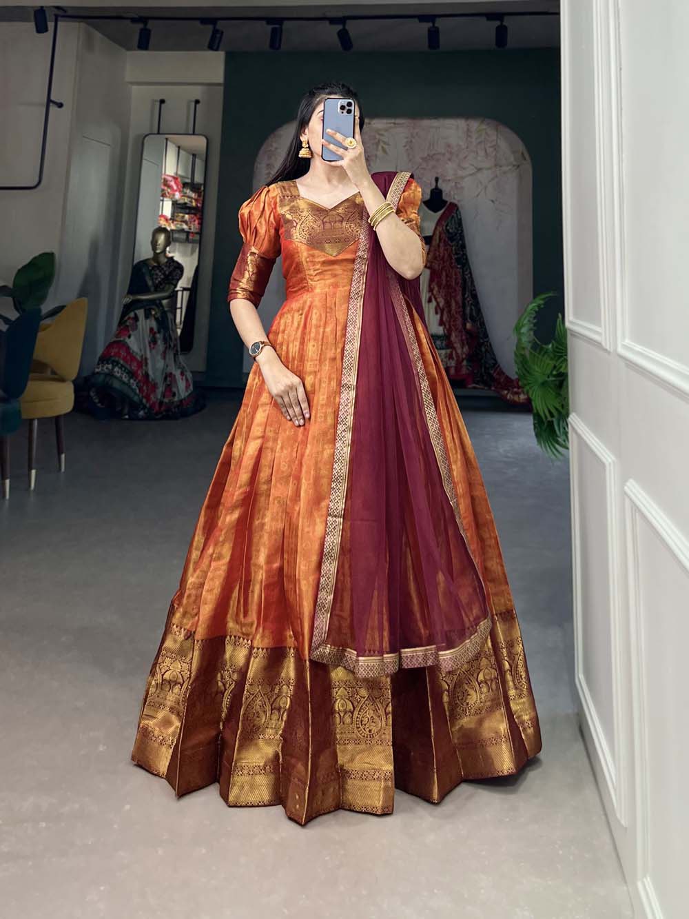 Regal Orange Zari Woven Kanjivaram Gown with Net Dupatta ClothsVilla