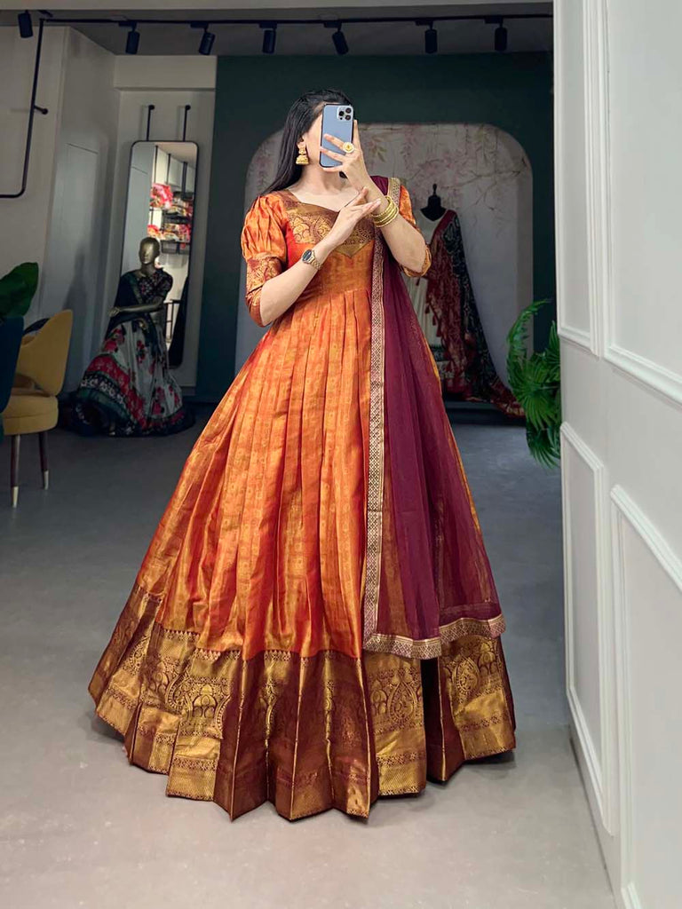 Regal Orange Zari Woven Kanjivaram Gown with Net Dupatta ClothsVilla