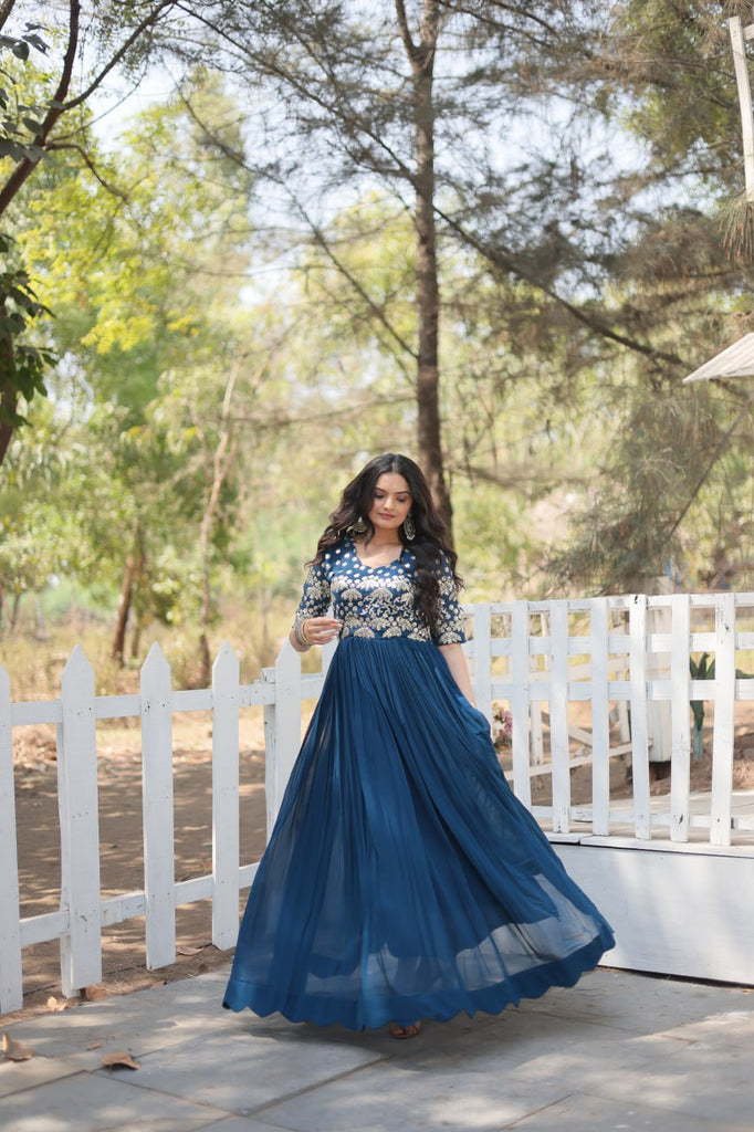 Tea Blue Luxury Faux Blooming Designer Gown with Zari & Tea Blue Luxury Faux Blooming Designer Gown with Zari &