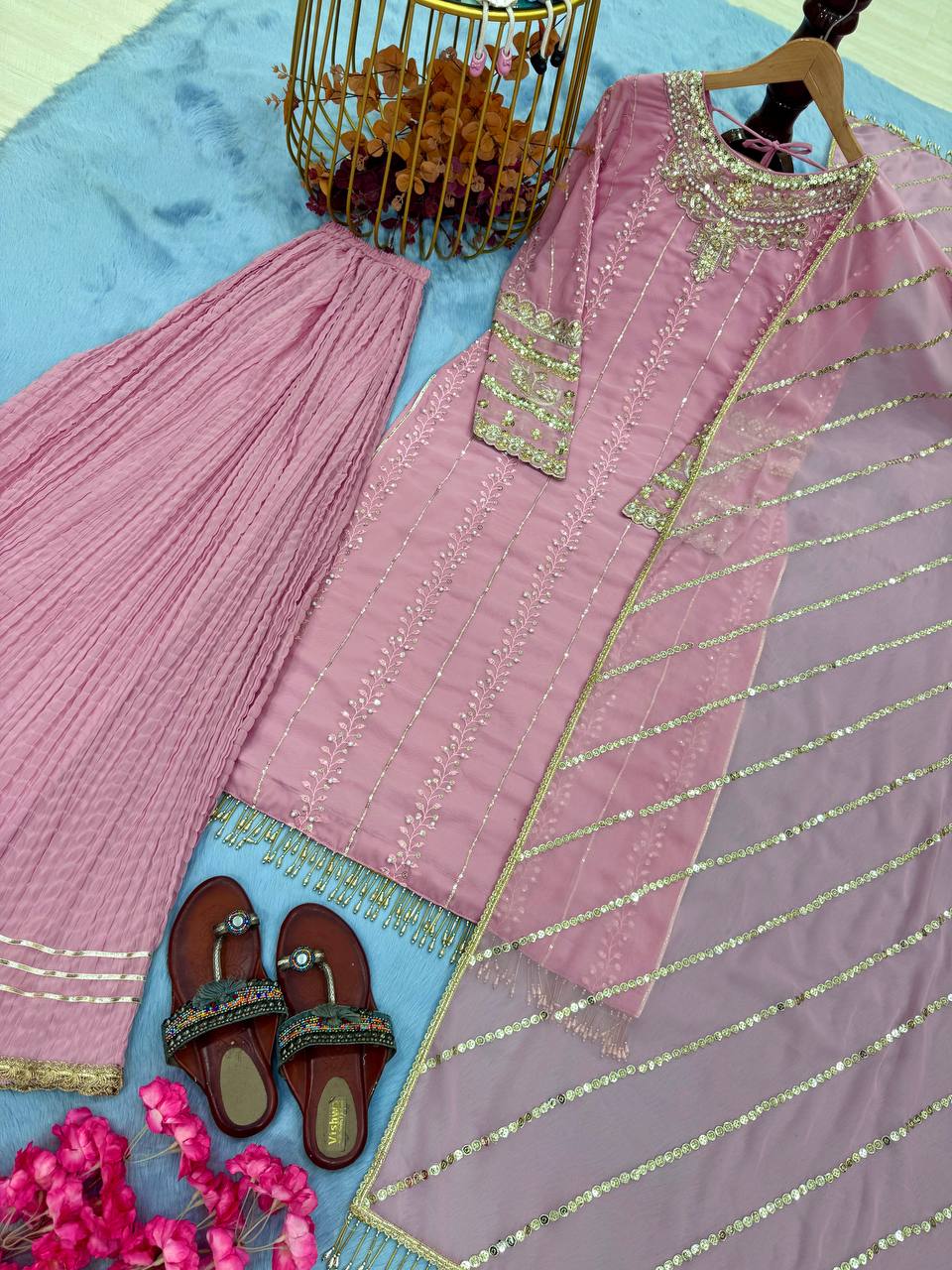 Pink Elegant Faux Georgette Embroidered Plazzo Set with Rivet Moti & Fancy Latkan Detailing ClothsVilla